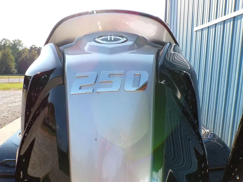 Slide: The Image of Skeeter FXR20L 2025 boat engine with "250" horsepower marking, near blue metal building. - 7