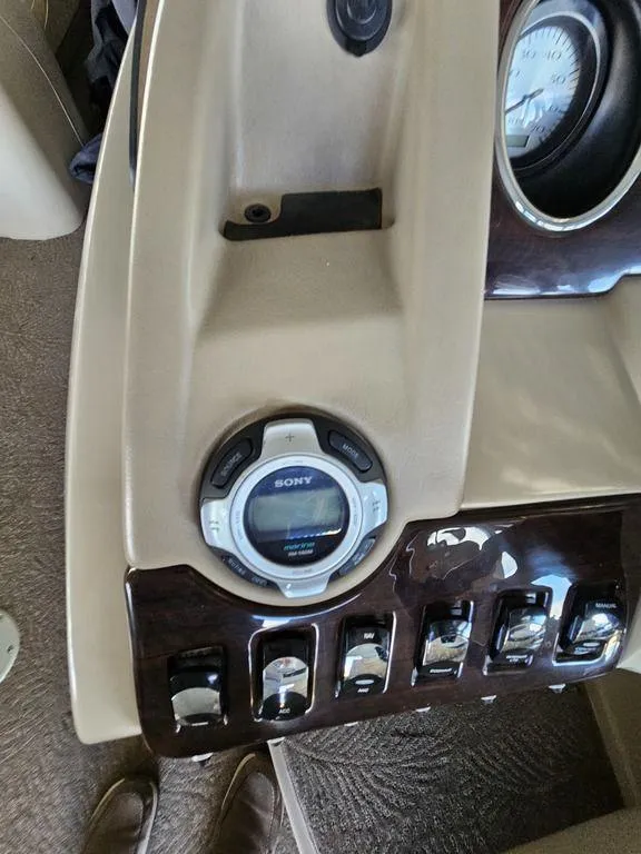 Slide: The Image of 2012 Bennington 25 RCW boat dashboard with Sony stereo and control switches. - 19