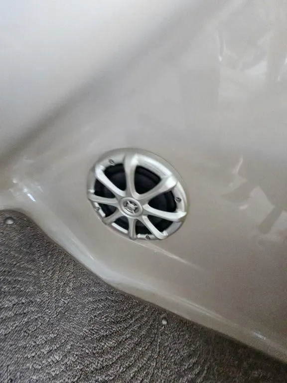 Slide: The Image of 2012 Bennington 25 RCW boat speaker on beige interior panel. - 21