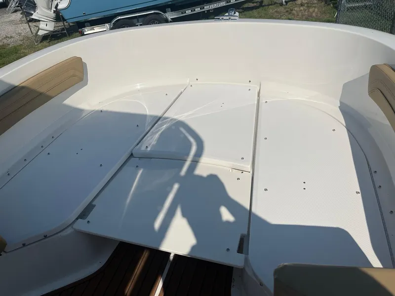 Slide: The Image of 2025 Bayliner Trophy T22CC boat interior with spacious seating and clean deck design. - 19