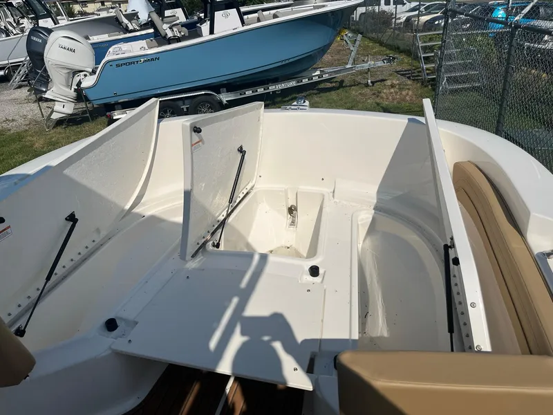 Slide: The Image of 2025 Bayliner Trophy T22CC boat interior with open storage compartments. - 20