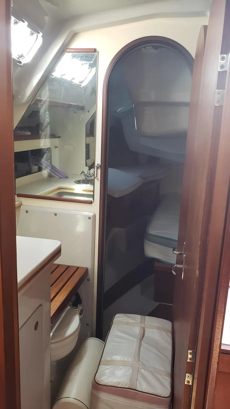 Slide: The Image of Interior of 1989 Hunter Legend 37 sailboat showing cabin and bathroom area. - 17