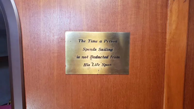 Slide: The Image of Plaque on 1989 Hunter Legend 37 sailboat with sailing quote on wooden panel. - 25