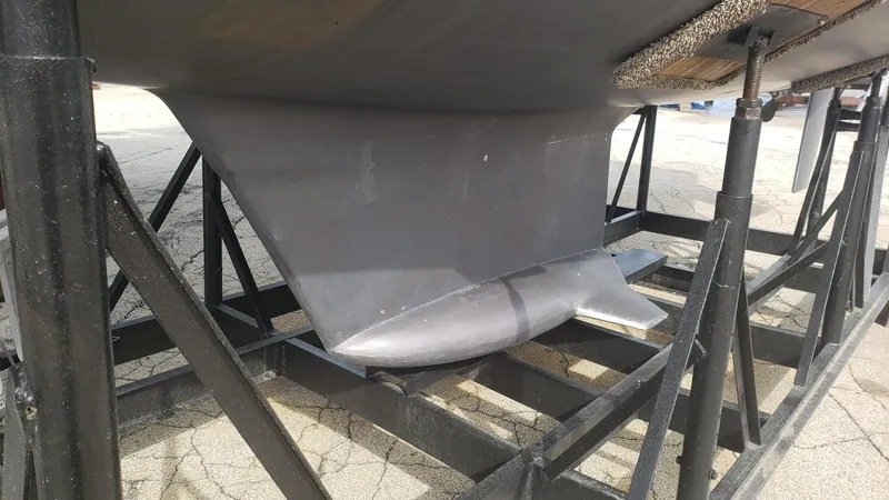 Slide: The Image of 1989 Hunter Legend 37 sailboat keel on a support stand. - 32