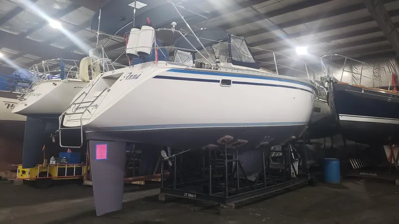 Slide: The Image of 1989 Hunter Legend 37 sailboat in indoor storage, elevated on stands. - 39