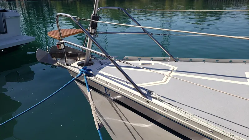 Slide: The Image of 1989 Hunter Legend 37 sailboat bow docked on calm water. - 6