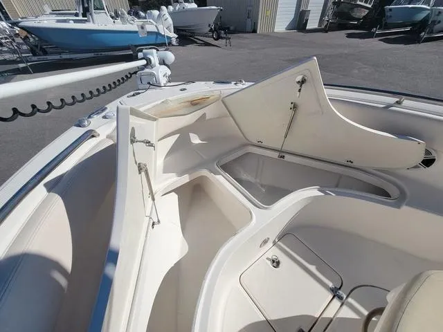 Slide: The Image of 2016 Robalo R222 boat interior with open storage compartments. - 13