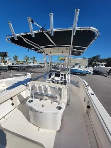 Slide: The Image of 2016 Robalo R222 boat with T-top, center console, and spacious deck. - 19