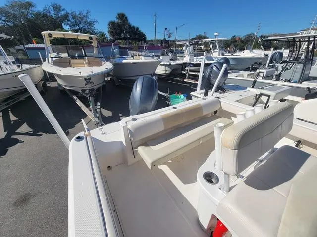 Slide: The Image of 2016 Robalo R222 boat interior with seating, parked among other boats. - 20