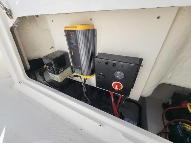 Slide: The Image of Electrical components inside a 2016 Robalo R222 boat compartment. - 21