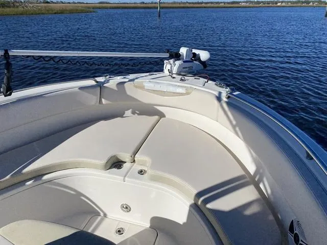 Slide: The Image of 2016 Robalo R222 boat bow with seating, on calm water. - 32
