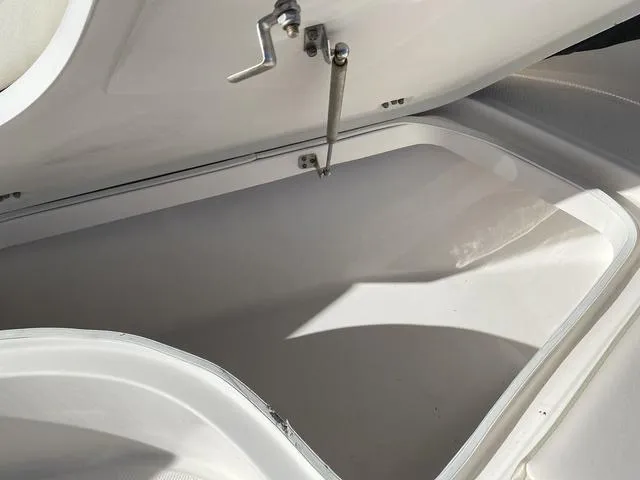Slide: The Image of Open storage compartment on a 2016 Robalo R222 boat. - 36