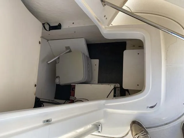 Slide: The Image of 2016 Robalo R222 boat interior with compact storage and seating area. - 37