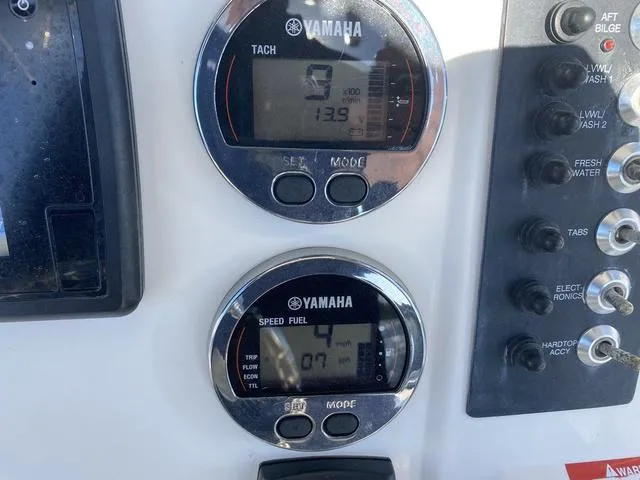 Slide: The Image of Yamaha gauges on 2016 Robalo R222 boat dashboard, showing tachometer and speed fuel readings. - 39