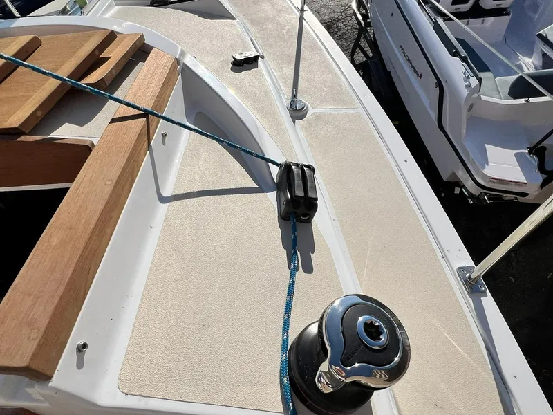 Slide: The Image of Deck of 2025 Tartan Fantail sailboat with winch and rope details. - 11