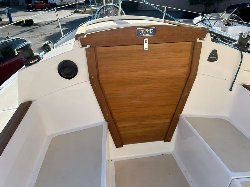 Slide: The Image of 2025 Tartan Fantail sailboat cockpit with wooden hatch and seating. - 12