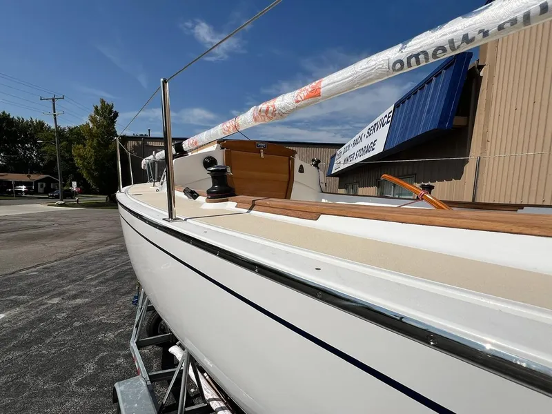 Slide: The Image of 2025 Tartan Fantail sailboat on trailer, outdoor setting, clear sky. - 6