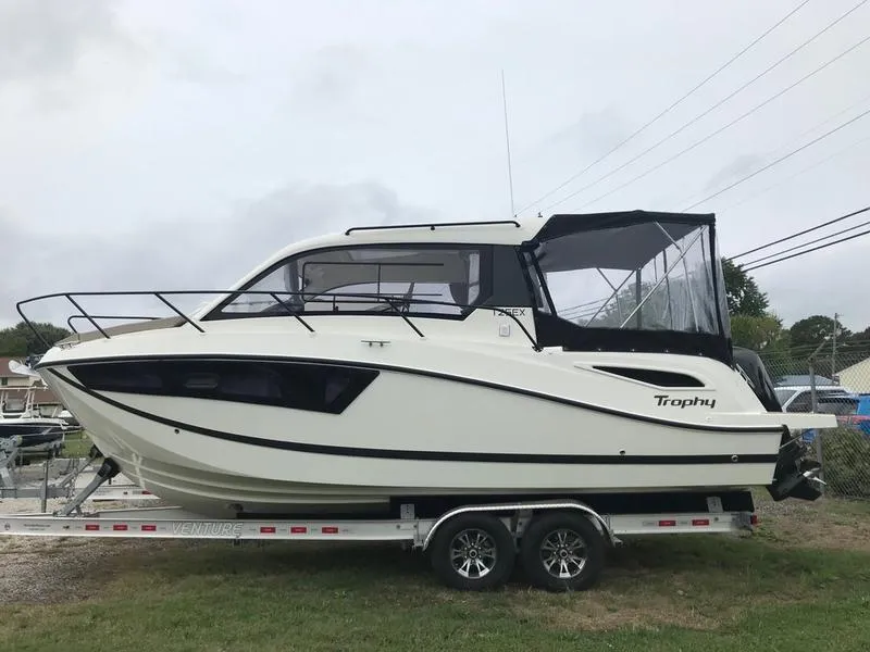 The Image of 2025 Bayliner Trophy T25 Explorer boat on trailer, side view, outdoors. - 0