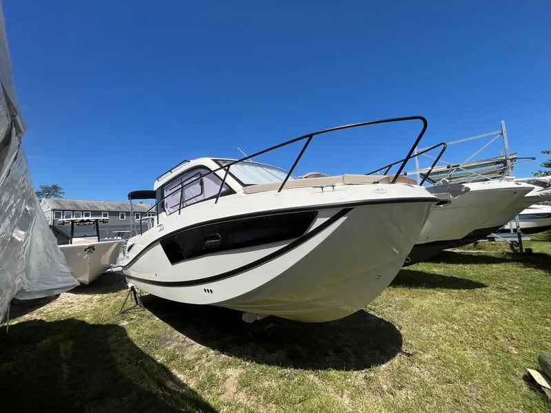 Slide: The Image of 2025 Bayliner Trophy T25 Explorer boat on display outdoors. - 2