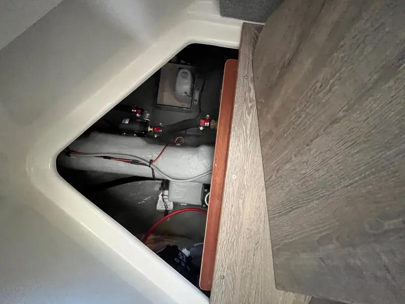 Slide: The Image of Interior view of 2025 Bayliner Trophy T25 Explorer boat, showcasing storage compartment. - 25