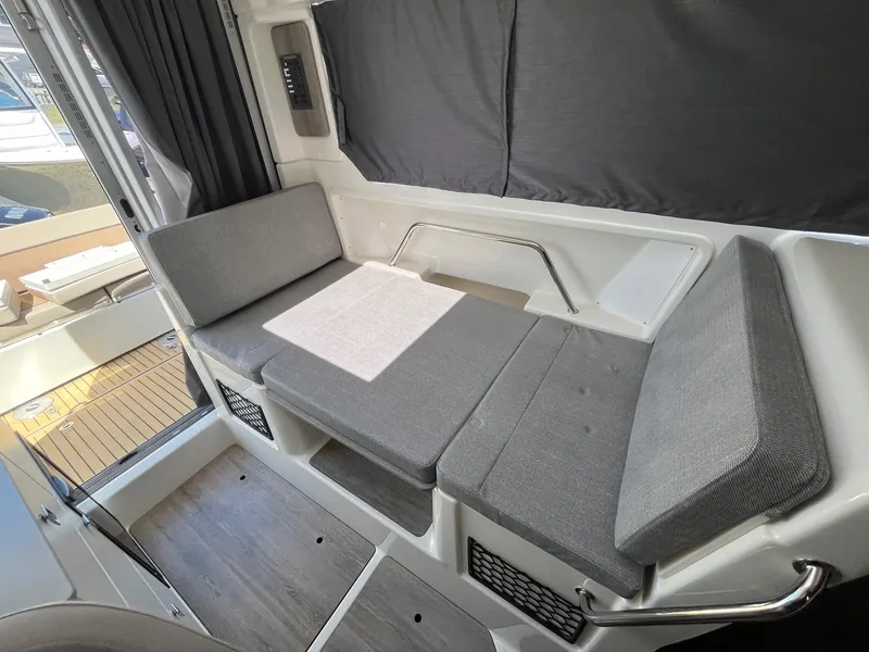 Slide: The Image of Interior seating area of 2025 Bayliner Trophy T25 Explorer with gray cushions. - 37