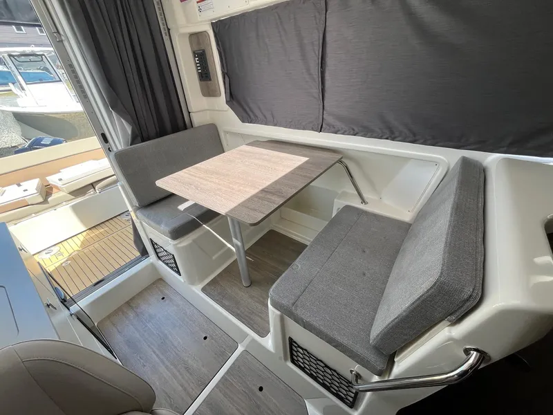 Slide: The Image of Interior of 2025 Bayliner Trophy T25 Explorer with seating and table. - 38