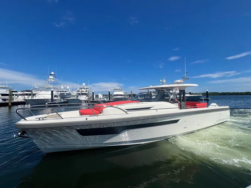 The Image of Nimbus T11 #98 TRADE! 2022 boat cruising in a marina under a clear blue sky. - 0