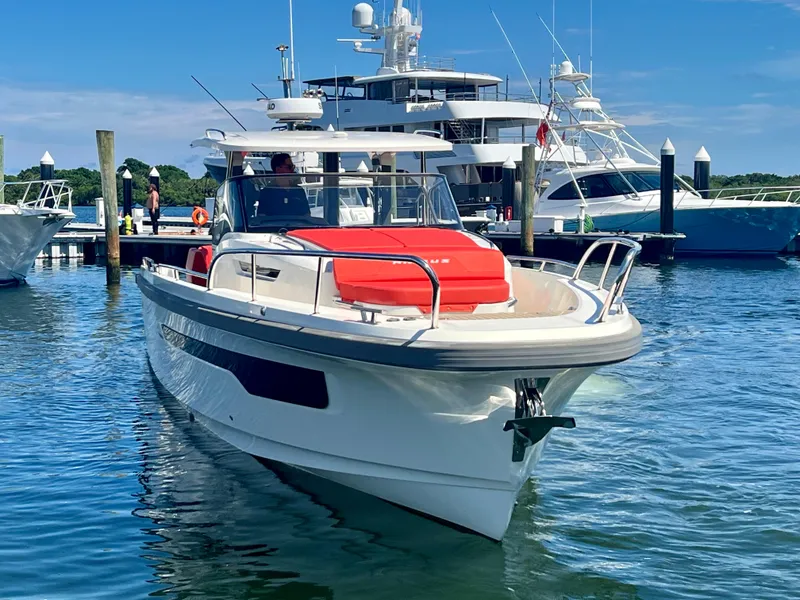 Slide: The Image of Nimbus T11 #98 TRADE! 2022 boat docked in marina, clear blue sky. - 11