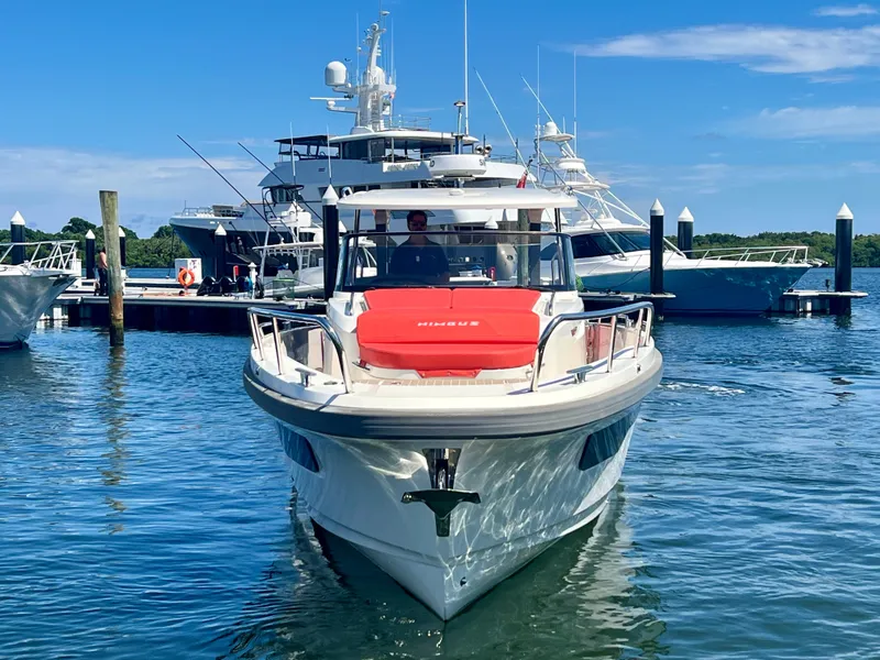 Slide: The Image of Nimbus T11 #98 TRADE! 2022 boat docked in marina, clear blue sky. - 12
