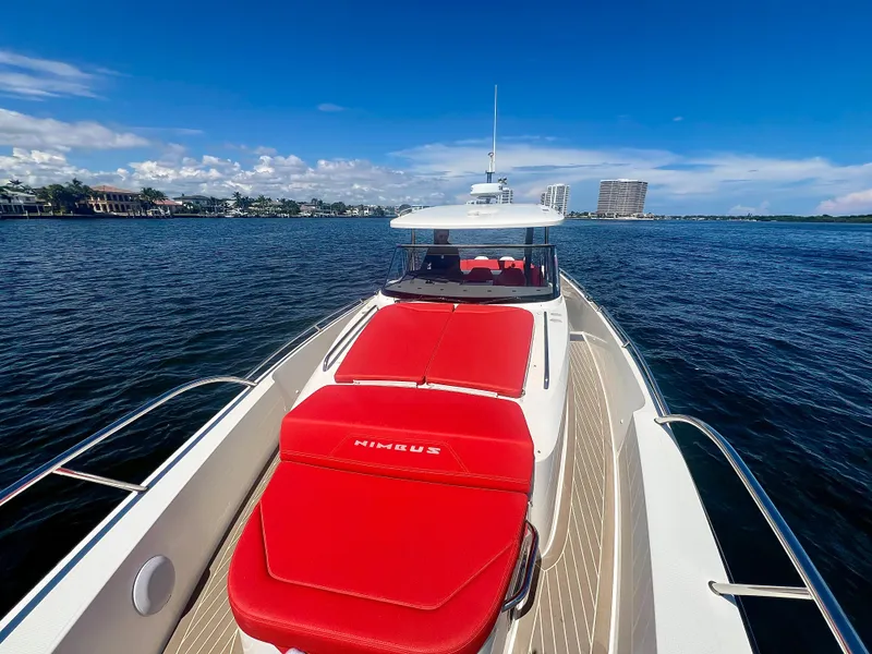 Slide: The Image of Nimbus T11 #98 TRADE! 2022 boat with red seating on open water. - 17