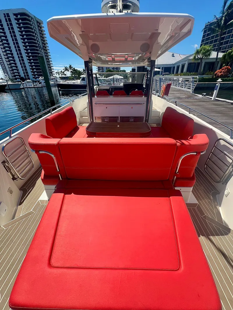 Slide: The Image of Red seating on 2022 Nimbus T11 #98 TRADE! boat docked at marina. - 20