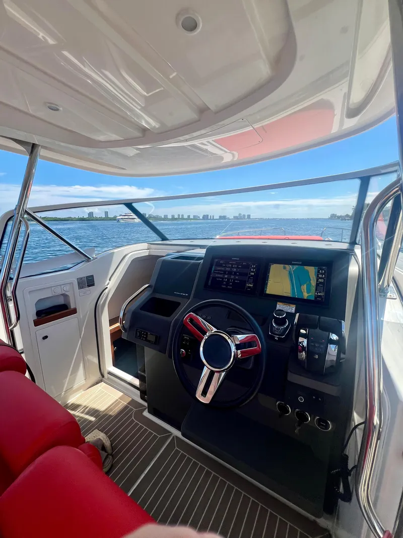 Slide: The Image of Interior view of 2022 Nimbus T11 #98 TRADE! boat cockpit with modern navigation system. - 24