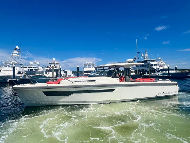 Slide: The Image of Nimbus T11 #98 TRADE! 2022 boat in marina, clear sky, calm water. - 3