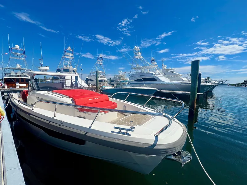 Slide: The Image of Nimbus T11 #98 TRADE! 2022 boat docked at marina under clear blue sky. - 5