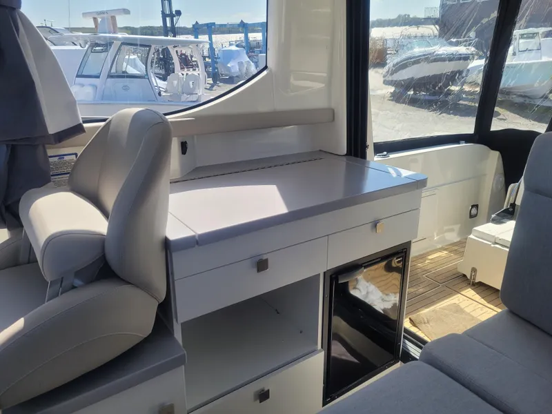 Slide: The Image of Interior of 2025 Bayliner Trophy T29 Explorer, featuring seating and storage compartments. - 10