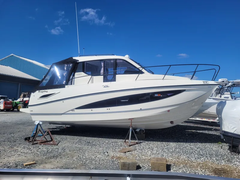 Slide: The Image of 2025 Bayliner Trophy T29 Explorer boat on display outdoors. - 2
