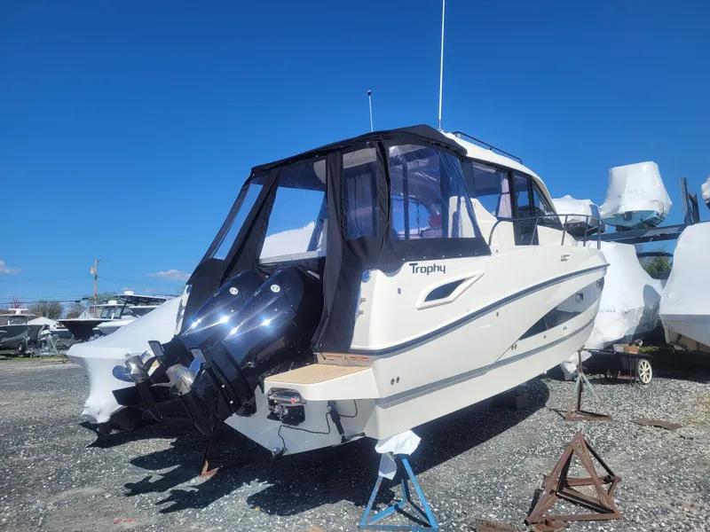 Slide: The Image of 2025 Bayliner Trophy T29 Explorer boat on display, featuring dual outboard motors. - 4