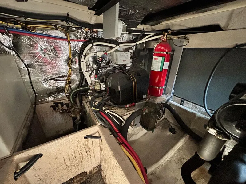Slide: The Image of Engine room of a 2011 Meridian 391 Sedan with fire extinguisher and wiring. - 10