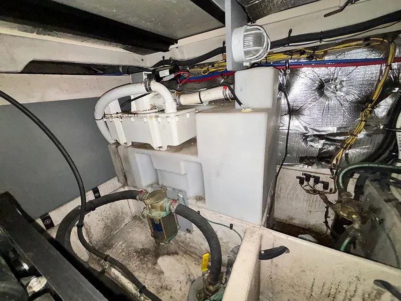 Slide: The Image of Engine room of a 2011 Meridian 391 Sedan with visible wiring and plumbing. - 11