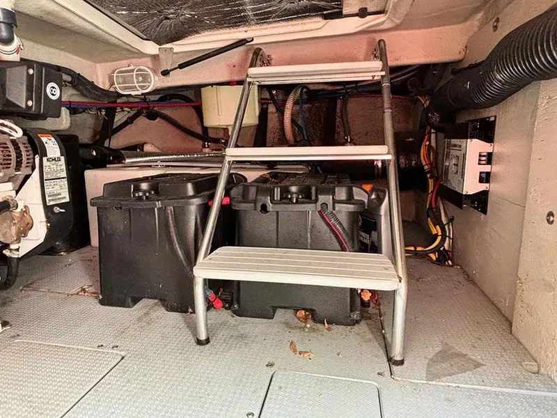 Slide: The Image of Engine compartment of 2011 Meridian 391 Sedan with batteries and wiring. - 12