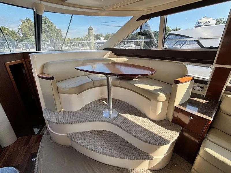 Slide: The Image of Luxurious interior of 2011 Meridian 391 Sedan yacht with elegant seating and table. - 16