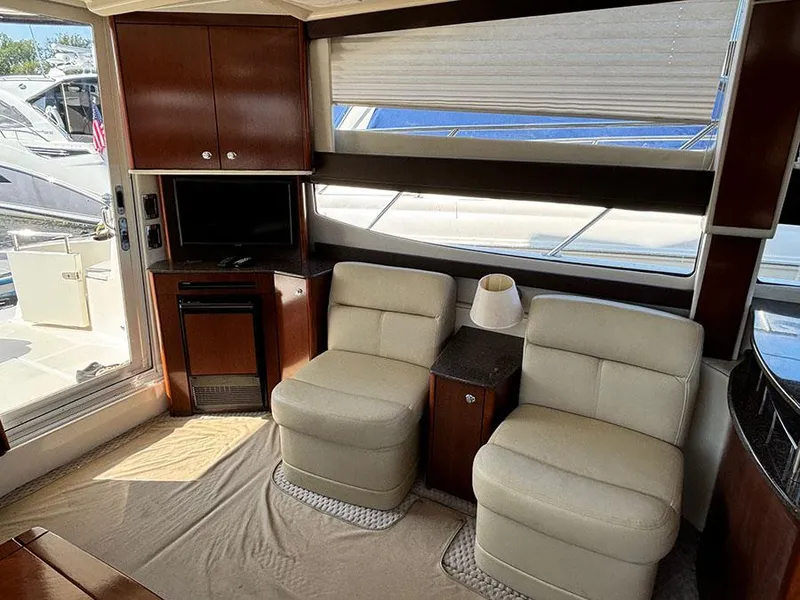 Slide: The Image of Interior of 2011 Meridian 391 Sedan yacht with plush seating and entertainment area. - 17