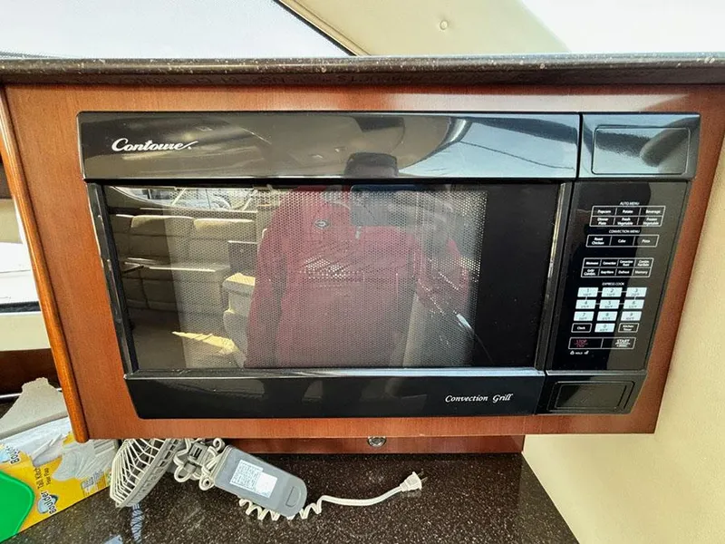 Slide: The Image of Microwave oven in 2011 Meridian 391 Sedan yacht kitchen area. - 21