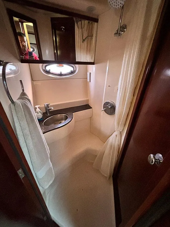 Slide: The Image of 2011 Meridian 391 Sedan bathroom with sink, shower, and towel rack. - 24
