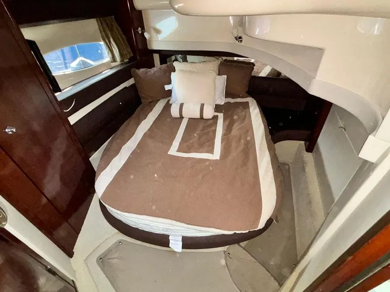 Slide: The Image of 2011 Meridian 391 Sedan cabin with cozy bed and elegant wood finish. - 25