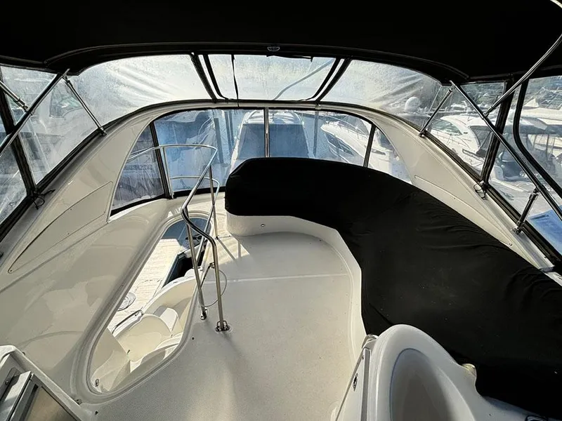 Slide: The Image of 2011 Meridian 391 Sedan boat interior with seating and windows. - 27