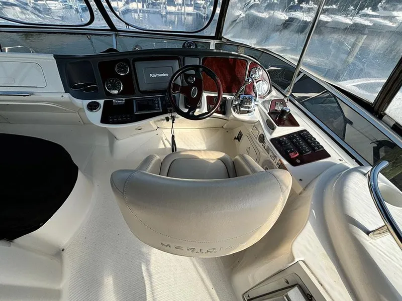 Slide: The Image of Interior of 2011 Meridian 391 Sedan yacht cockpit with steering wheel and navigation equipment. - 32