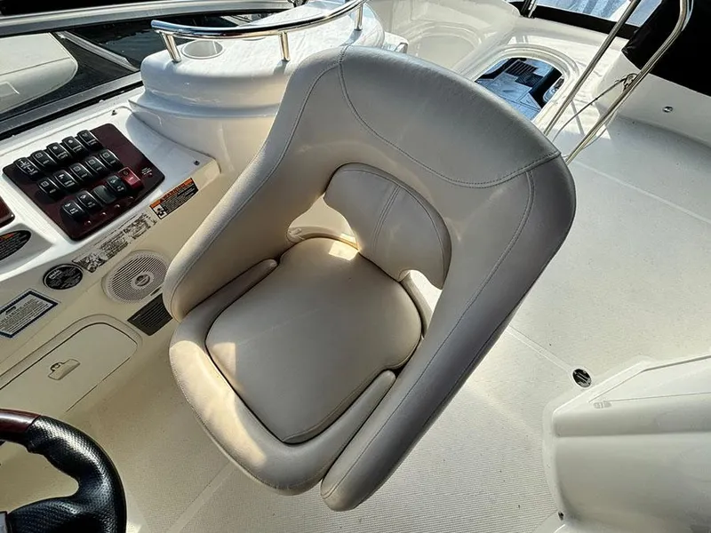 Slide: The Image of Captain's chair on 2011 Meridian 391 Sedan yacht, featuring sleek design and control panel. - 33