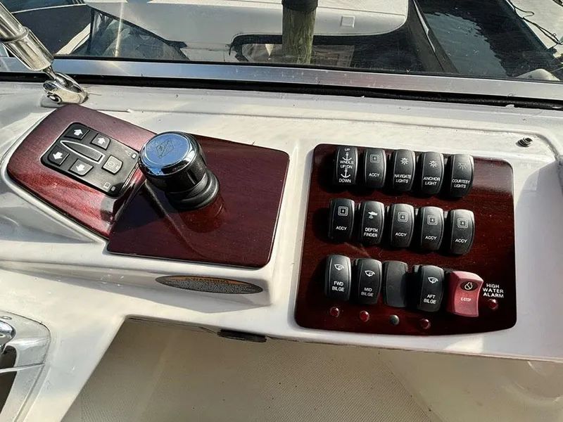 Slide: The Image of Control panel of a 2011 Meridian 391 Sedan boat with various switches and controls. - 34