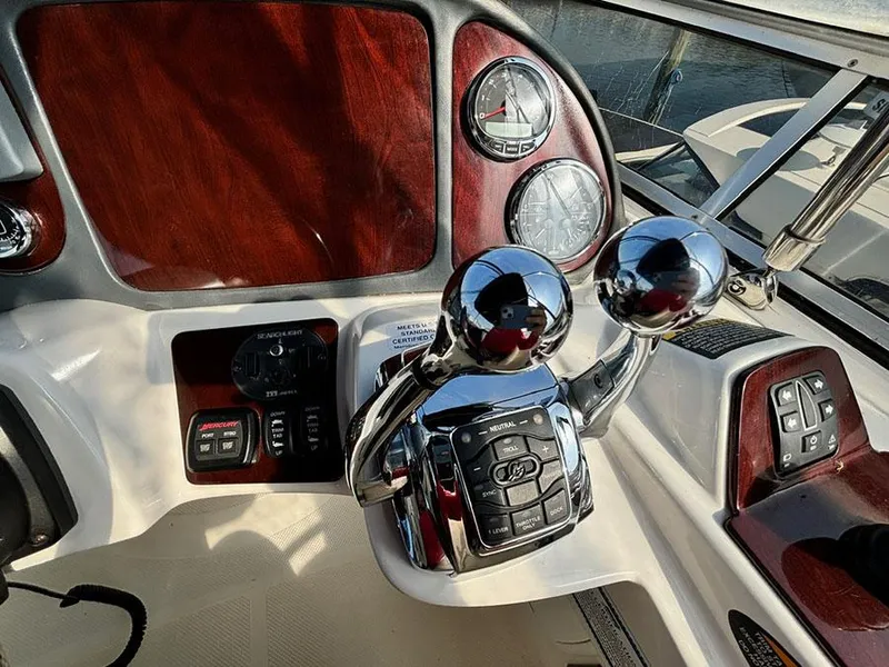 Slide: The Image of 2011 Meridian 391 Sedan dashboard with chrome controls and wood paneling. - 35